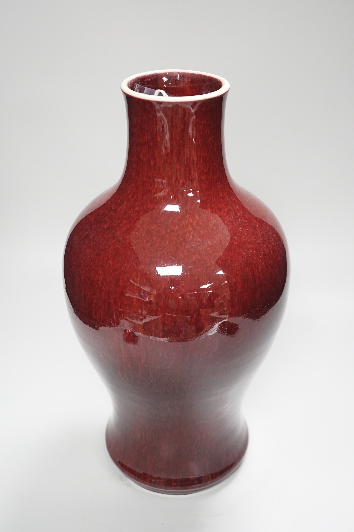 A 19th century Chinese sang de boeuf vase, neck cut down, 36.5cms high